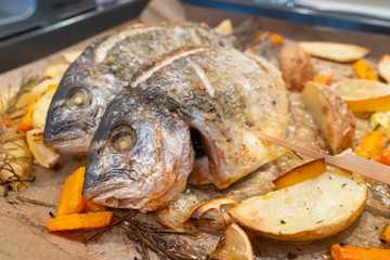 Perfectly cooked sea bream on oven-cooked vegetables