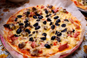 Overhead shot of friends at a table sharing take-away pizzas