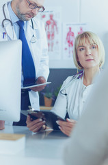 Doctor and nurse working in office at hospital