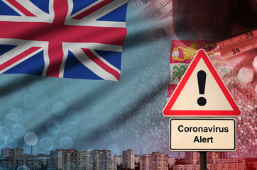 Fiji flag and Coronavirus 2019-nCoV alert sign. Concept of high probability of novel coronavirus...