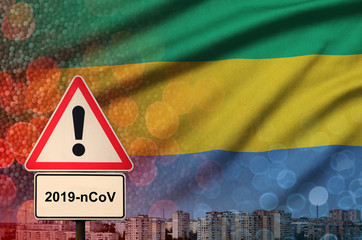 Gabon flag and Coronavirus 2019-nCoV alert sign. Concept of high probability of novel coronavirus...