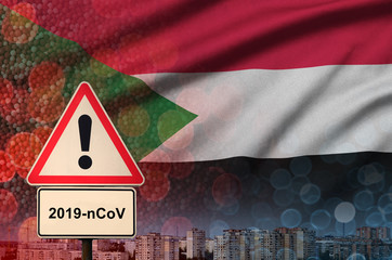 Sudan flag and Coronavirus 2019-nCoV alert sign. Concept of high probability of novel coronavirus...