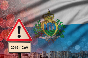 San Marino flag and Coronavirus 2019-nCoV alert sign. Concept of high probability of novel...