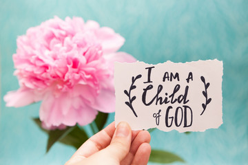 I am a child of God - christian calligraphy lettering on card with pink peony flower, biblical...