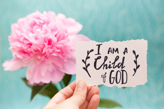 I am a child of God - christian calligraphy lettering on card with pink peony flower, biblical verce and religion concept