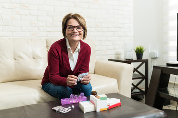 Senior Caucasian Woman Taking Medicines At Home