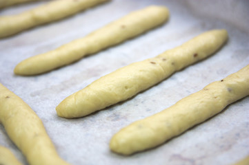 A baking tray with snack bars about to be baked at home
