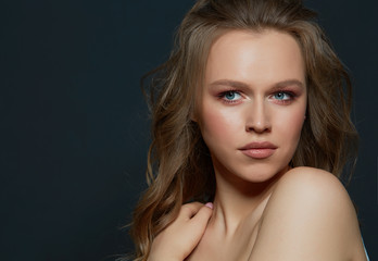 Fototapeta premium Beautiful woman's face with tan. clean skin - isolated on black