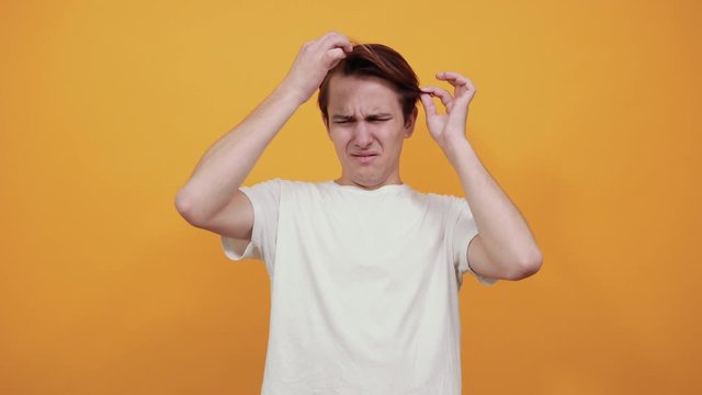 Handsome man with a haircut barber shop discontent