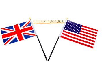 The flags of the United Kingdom and the United States isolated on a white background with a sign reading Different