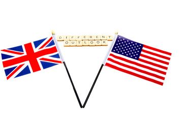 The flags of the United Kingdom and the United States isolated on a white background with a sign reading Different Outlook