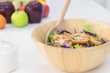 Salads that are being cooked in a wooden bowl, Healthy food concept