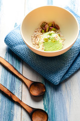 Pistachio ice cream with white chocolate on modern table. Healthy food. Vegan food