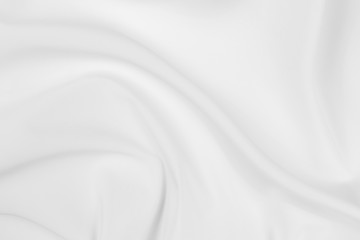 Abstract white fabric texture background. Cloth soft wave. Creases of satin, silk, and cotton.	