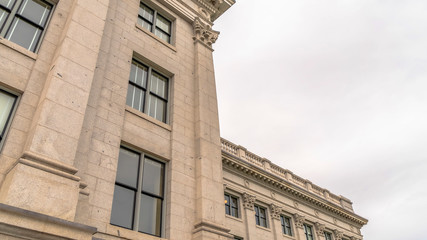 Panorama Utah State Capitol Building with decorative mouldings viewed against cloudy sky