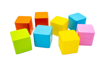 Obraz premium Multicolored cubic wooden building blocks isolated on white background.