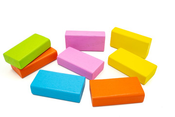 Multicolored rectangle wooden building blocks isolated on white background.