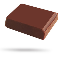 Delicious black chocolate shavings and pieces on white background, top view