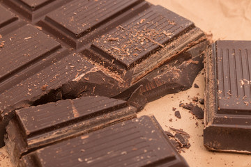 Confectionery dark chocolate in dragee on a white background