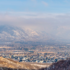 Square Mountain with grasses and blanketed with fresh snow on a cold winter day