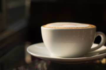 Coffee espresso on wood table cafe coffee background in garden,warm tone