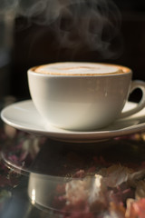 Coffee espresso on wood table cafe coffee background in garden,warm tone