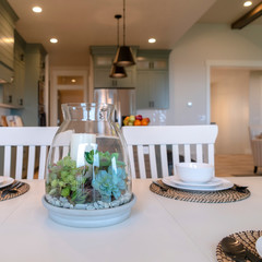 Square frame Table setting on family home with white tableware and ornamental plant