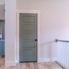Square frame Interior of house with gray door white wall and brown wooden floor