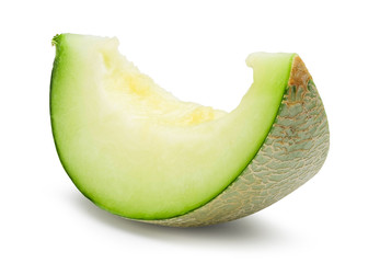 Ripe green melon slice isolated on white with clipping path.