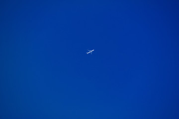 Plane in the deep blue sky