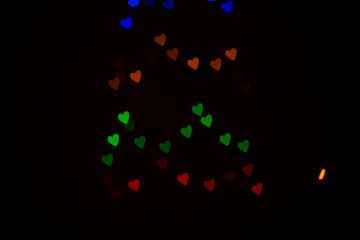 Naklejka na ściany i meble Colorful abstract heart shape blured bokeh at night