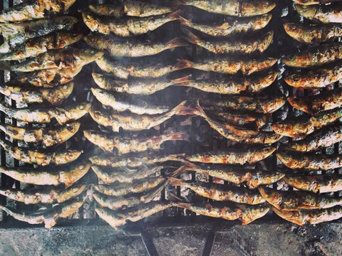 Directly Above Shot Of Fish Cooking On Barbecue Grill