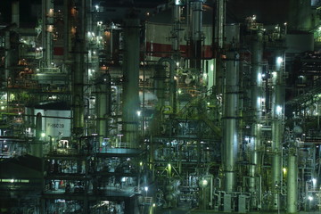 Fantastic night view of the factory with green light in Yokkaichi, Japan.