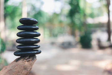 Balance stone with spa on nature bokeh background