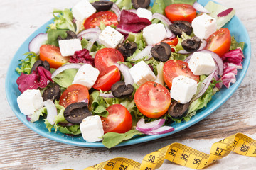 Greek salad with feta cheese and vegetables. Healthy lifestyles, food and slimming