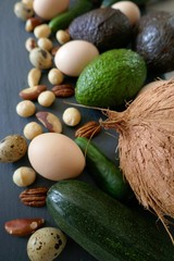 Ketogenic Diet.Lchf. Avocado,coconut,  eggs and nuts on a black slate background.Keto products. Keto food.  low carb diet.