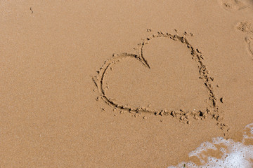 Heart draw on the shore of the sea