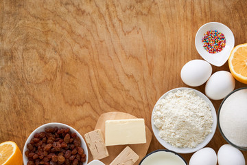 Ingredients for making easter cake on a wooden table