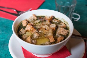 Trentino vegetable soup with melted cheese
