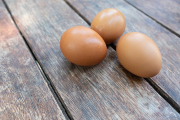 Eggs on wood texture for cook.
