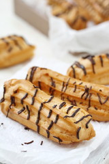 Traditional french eclairs with cream and chocolate