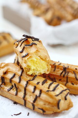 Traditional french eclairs with cream and chocolate