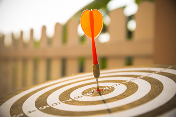 Close up red color arrow in the center of Bullseye or bull's-eye for business targeting and good...