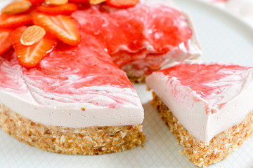  Cake with nuts and strawberries and books as a gift. Raw desserts