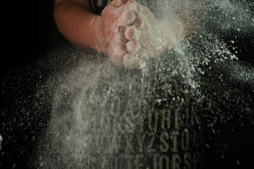 Fototapeta na wymiar women's hands sift the flour