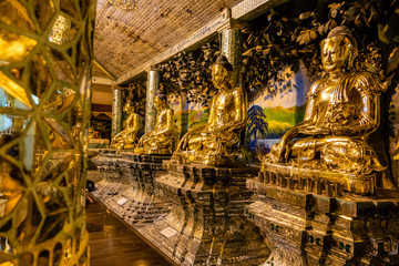 Golden Buddhas at Shwedagon pagoda in Yangon