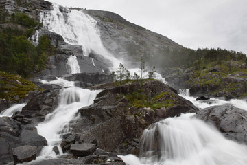 Fototapeta na wymiar long time exposure of the powerful Tvindefossen in Norway