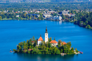 Fototapeta na wymiar Aerial view of Bled Island and Lake Bled from Osojnica Hill, a popular tourist destination in Slovenia