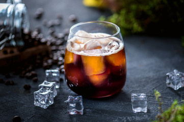 Ice coffee on rustic background