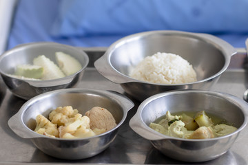 Thai food in a tray for hospital patients.